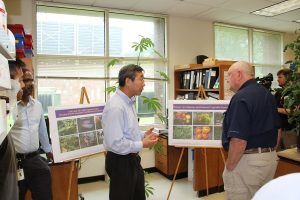 CucCAP researchers explain research projects to Dr. Perdu